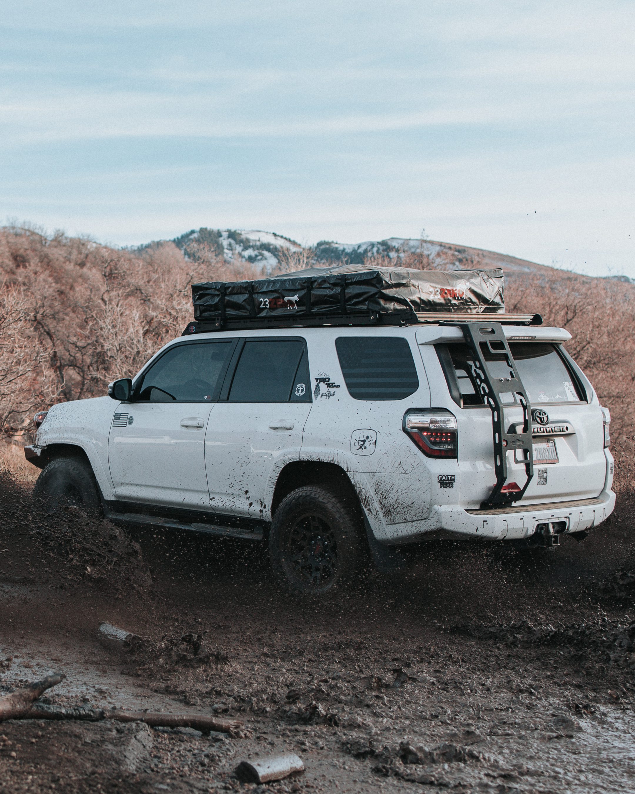4Runner in Mud with 23Zero Walkabout Soft Shell Rooftop Tent